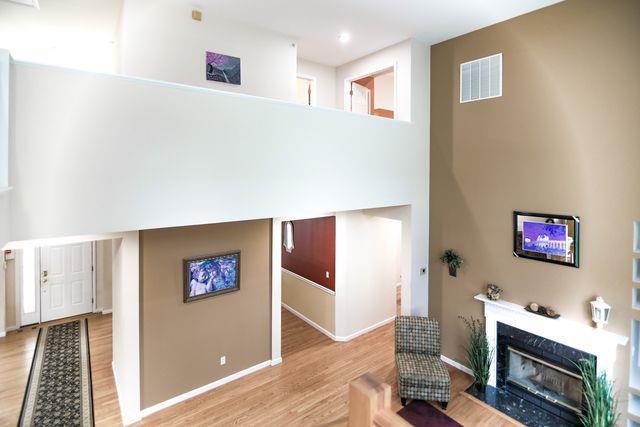 97 Reunion Rd, White Plains, NY 10603 - living room with wood finished floors and a fireplace with flush hearth