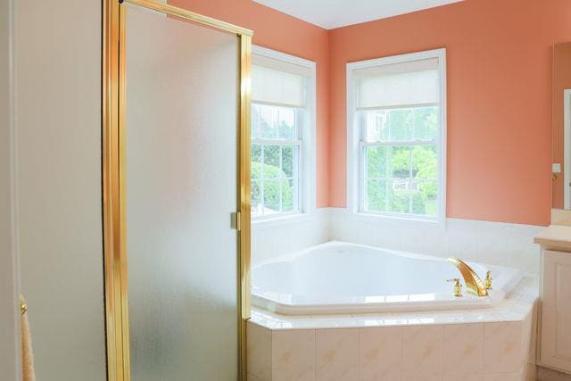 97 Reunion Rd, White Plains, NY 10603 - full bath with vanity, a stall shower, and a garden tub