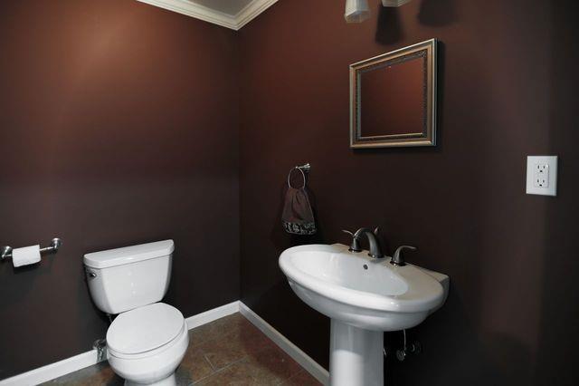 97 Reunion Rd, White Plains, NY 10603 - bathroom with crown molding and tile patterned floors