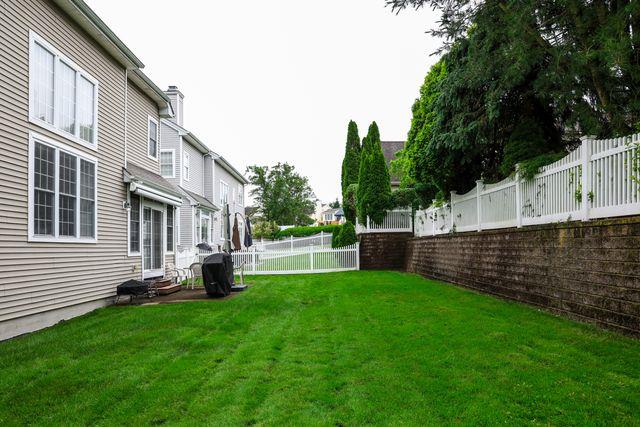 97 Reunion Rd, White Plains, NY 10603 - fenced backyard featuring a residential view