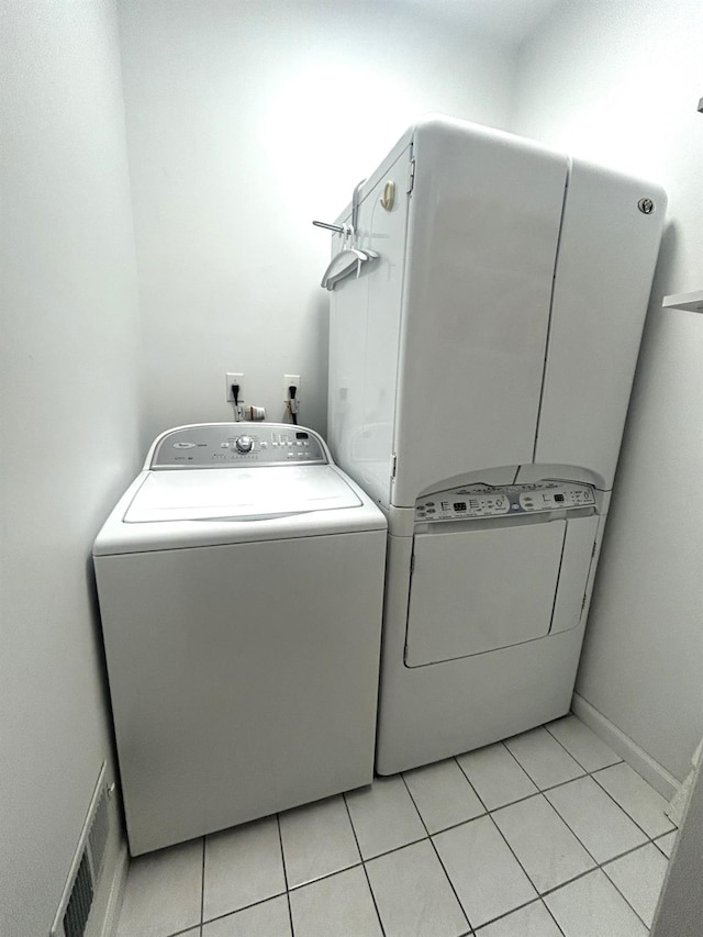 97 Reunion Rd, White Plains, NY 10603 - laundry area featuring independent washer and dryer and light tile patterned floors