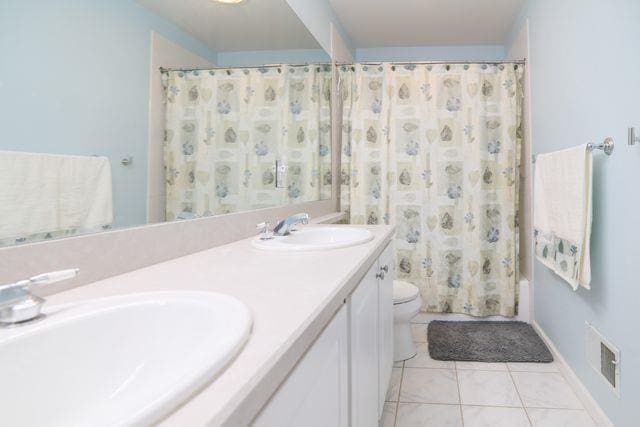 97 Reunion Rd, White Plains, NY 10603 - full bath with tile patterned floors and double vanity