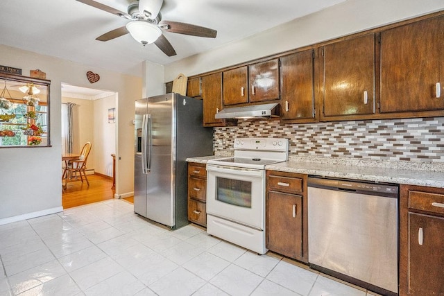 30 Lincoln Ave, Port Jefferson Station, NY 11776 - kitchen with stainless steel appliances, under cabinet range hood, tasteful backsplash, and ceiling fan