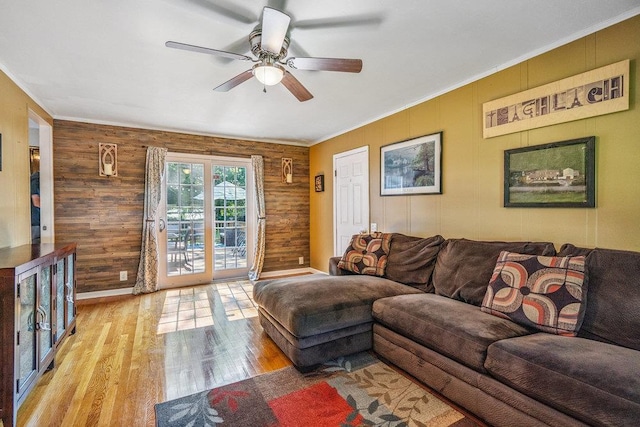 30 Lincoln Ave, Port Jefferson Station, NY 11776 - living room featuring a ceiling fan, wood finished floors, crown molding, and wood walls