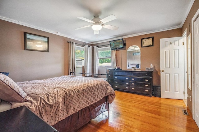 30 Lincoln Ave, Port Jefferson Station, NY 11776 - bedroom featuring light wood-type flooring, ornamental molding, cooling unit, and a ceiling fan
