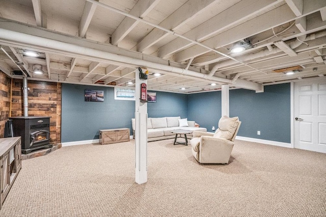 30 Lincoln Ave, Port Jefferson Station, NY 11776 - carpeted living area featuring a wood stove and baseboards