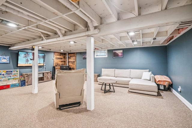 30 Lincoln Ave, Port Jefferson Station, NY 11776 - carpeted living room featuring a wood stove