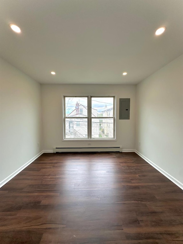 37 E Fulton St, Lido Beach, NY 11561 - empty room with electric panel, dark wood-style floors, recessed lighting, and baseboard heating