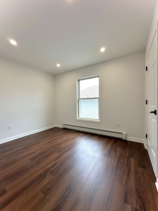 37 E Fulton St, Lido Beach, NY 11561 - empty room featuring a baseboard heating unit, dark wood finished floors, and recessed lighting