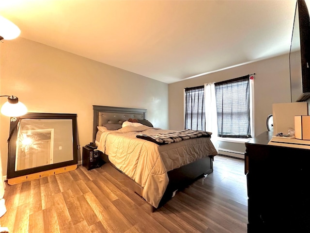 37 E Fulton St, Lido Beach, NY 11561 - bedroom with wood finished floors and a baseboard radiator