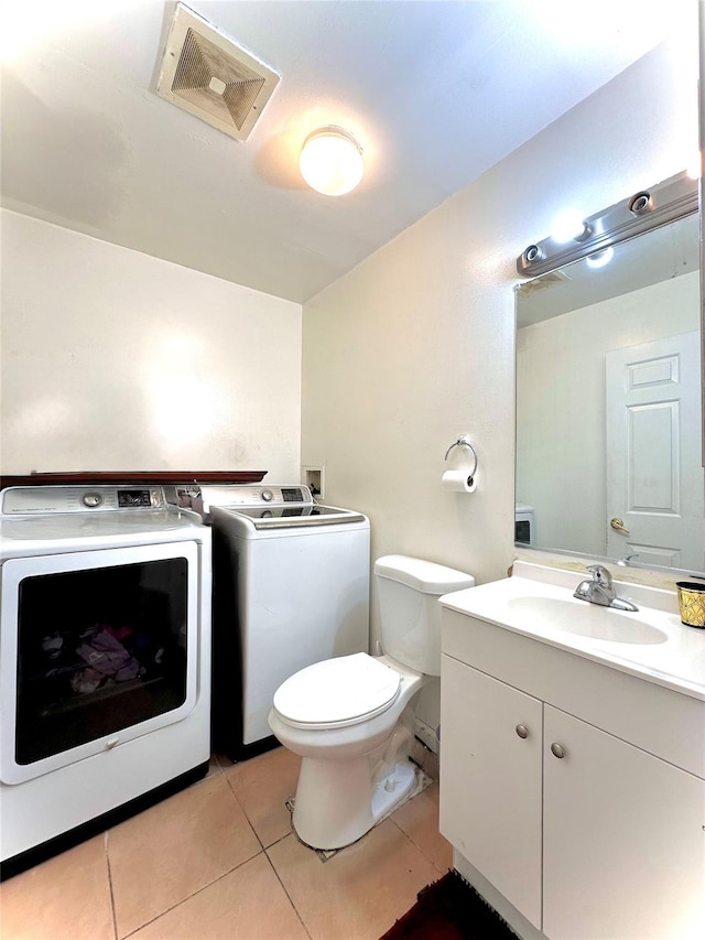37 E Fulton St, Lido Beach, NY 11561 - bathroom with washer and clothes dryer, vanity, and tile patterned flooring