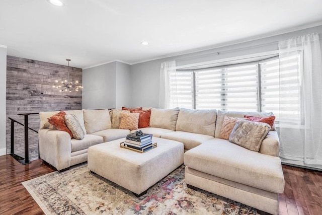 544 S 15th St, Lindenhurst, NY 11757 - living room with crown molding, wood finished floors, a chandelier, recessed lighting, and wooden walls