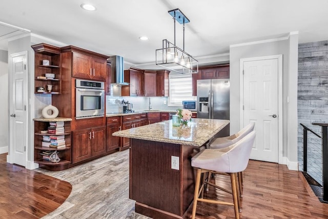 544 S 15th St, Lindenhurst, NY 11757 - kitchen with appliances with stainless steel finishes, open shelves, crown molding, wall chimney range hood, and light wood-style floors
