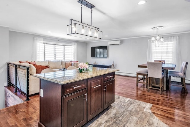 544 S 15th St, Lindenhurst, NY 11757 - kitchen with crown molding, an AC wall unit, a chandelier, wood finished floors, and recessed lighting
