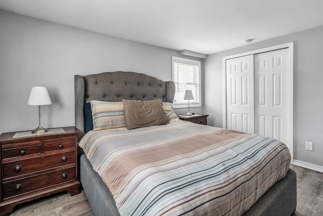 544 S 15th St, Lindenhurst, NY 11757 - bedroom featuring a closet and wood finished floors