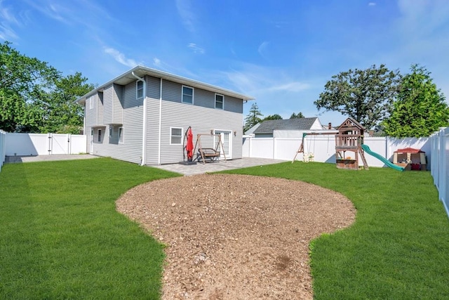 544 S 15th St, Lindenhurst, NY 11757 - back of house featuring a gate, a patio area, a fenced backyard, and a playground