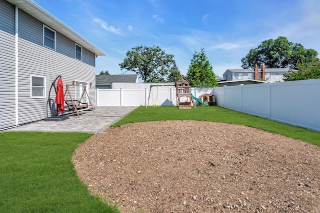 544 S 15th St, Lindenhurst, NY 11757 - fenced backyard with a playground and a patio