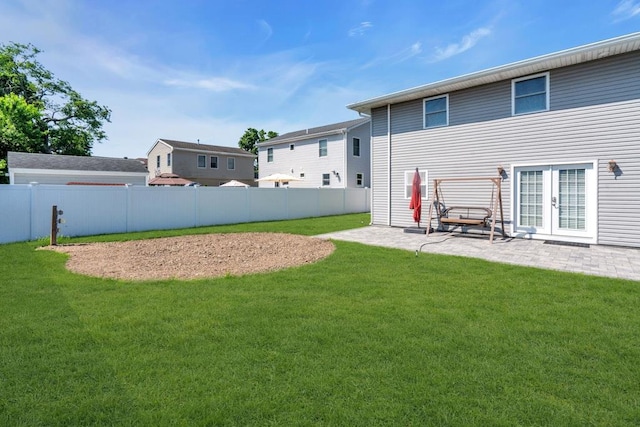 544 S 15th St, Lindenhurst, NY 11757 - fenced backyard with a patio and french doors