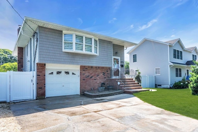 544 S 15th St, Lindenhurst, NY 11757 - view of front of property with brick siding, concrete driveway, and an attached garage