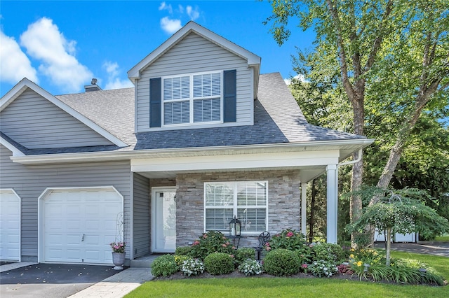 122 Maya Cir, Central Islip, NY 11722 - view of front of property with a shingled roof, covered porch, a garage, and asphalt driveway
