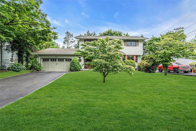 29 Cardinal Ln, Hauppauge, NY 11788 - view of front of house with driveway, a front lawn, and a garage