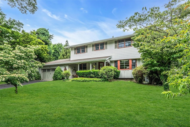 29 Cardinal Ln, Hauppauge, NY 11788 - view of front of property featuring a garage, a front yard, driveway, and a porch