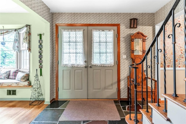 29 Cardinal Ln, Hauppauge, NY 11788 - foyer entrance featuring wallpapered walls and wood finished floors