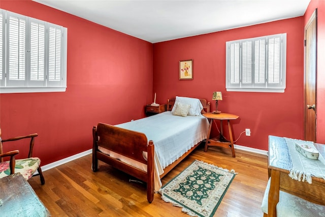 29 Cardinal Ln, Hauppauge, NY 11788 - bedroom featuring wood finished floors and baseboards