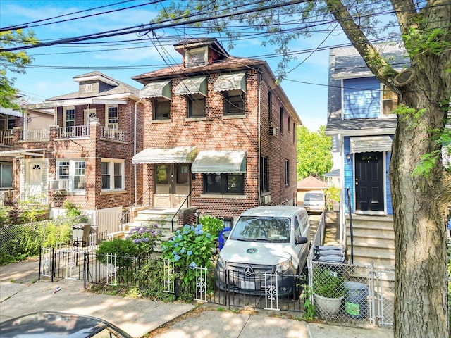 4026 Wickham Ave, Bronx, NY 10466 - view of front facade featuring a fenced front yard, brick siding, and entry steps