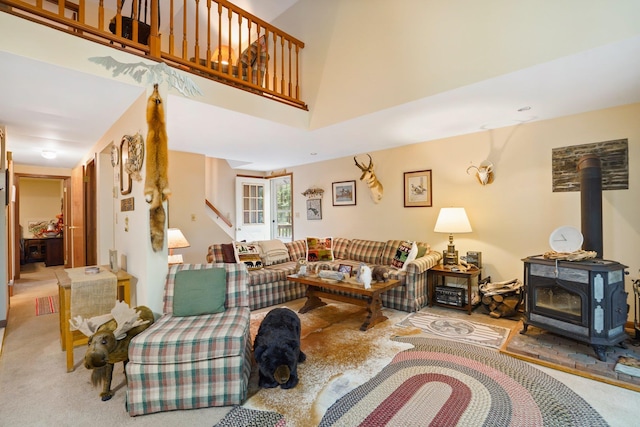16 Canal Rd, Wurtsboro, NY 12790 - living area featuring a wood stove, carpet floors, and stairway