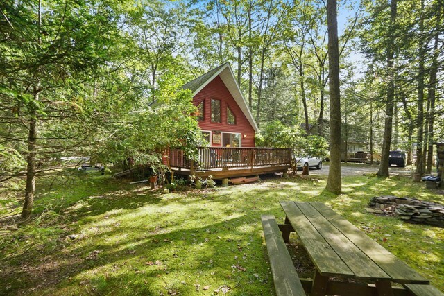 16 Canal Rd, Wurtsboro, NY 12790 - rear view of house featuring a wooden deck and a yard