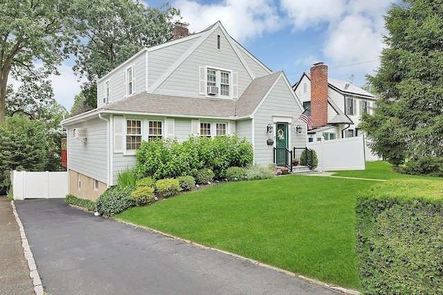 41 Cowdrey St, Yonkers, NY 10701 - view of front facade featuring a chimney and a shingled roof