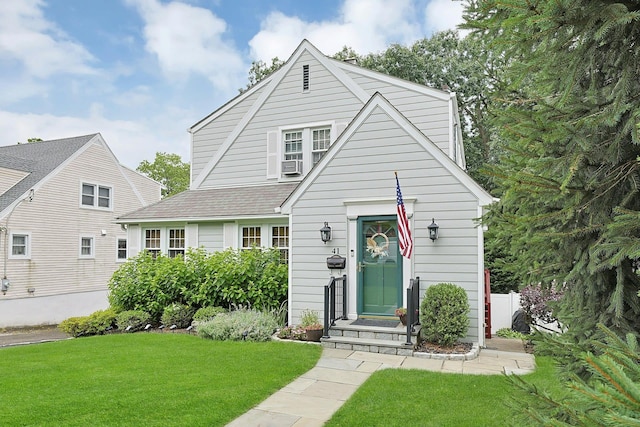 41 Cowdrey St, Yonkers, NY 10701 - view of front of house featuring a front lawn, cooling unit, and roof with shingles