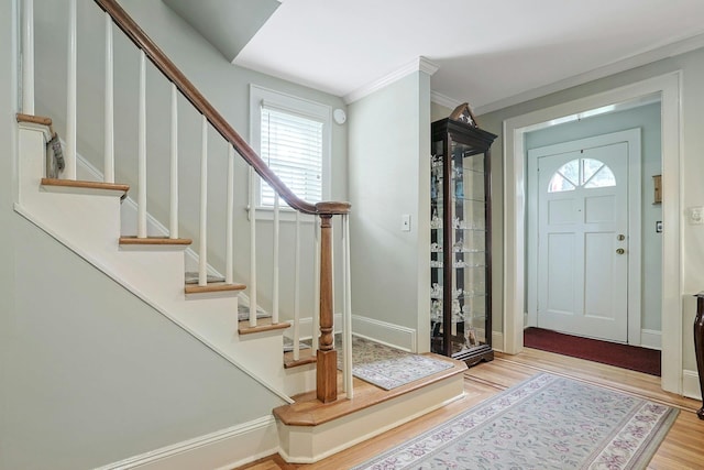 41 Cowdrey St, Yonkers, NY 10701 - foyer featuring wood finished floors, stairway, and ornamental molding