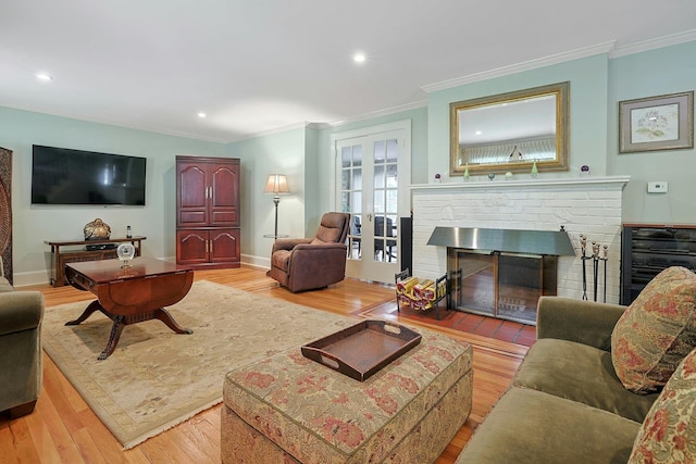 41 Cowdrey St, Yonkers, NY 10701 - living room featuring light wood-style floors, crown molding, a fireplace, and recessed lighting
