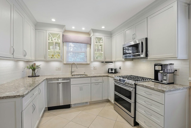 41 Cowdrey St, Yonkers, NY 10701 - kitchen with stainless steel appliances, light tile patterned floors, decorative backsplash, and recessed lighting