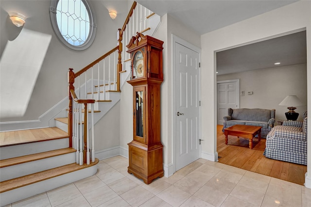 17 Singworth St, Oyster Bay, NY 11771 - staircase with tile patterned floors and recessed lighting