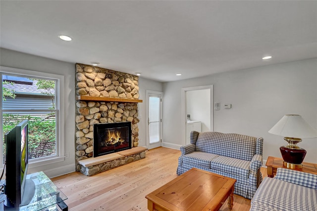17 Singworth St, Oyster Bay, NY 11771 - living room with light wood-style flooring, a stone fireplace, and recessed lighting