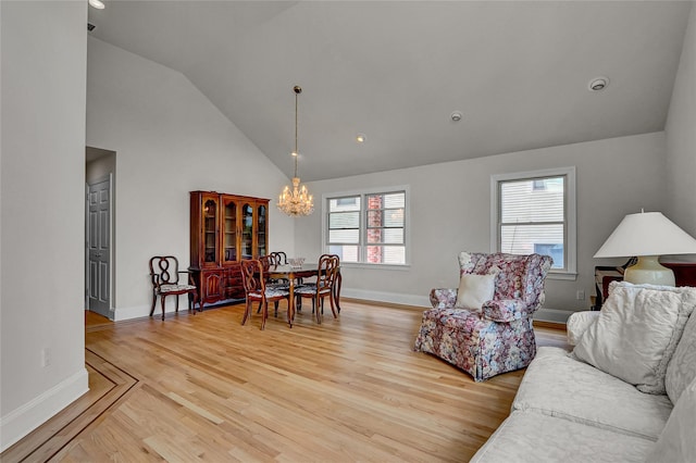 17 Singworth St, Oyster Bay, NY 11771 - living area with a chandelier, light wood finished floors, high vaulted ceiling, and recessed lighting