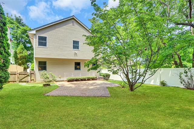 17 Singworth St, Oyster Bay, NY 11771 - back of property with a fenced backyard and a patio