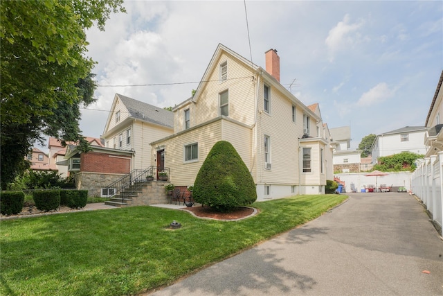 71 Dell Ave, Mount Vernon, NY 10553 - view of side of property featuring a chimney and a residential view