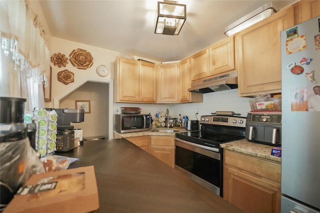 71 Dell Ave, Mount Vernon, NY 10553 - kitchen featuring stainless steel appliances, under cabinet range hood, light brown cabinets, and tasteful backsplash