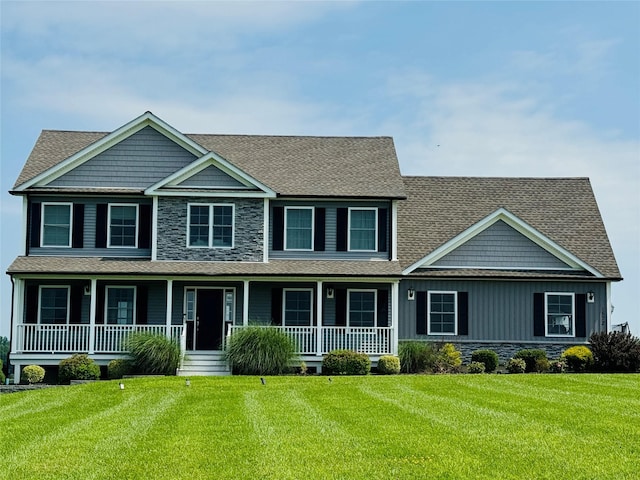 1572 State Route 52, Walden, NY 12586 - view of front facade featuring stone siding, covered porch, a front yard, and a shingled roof