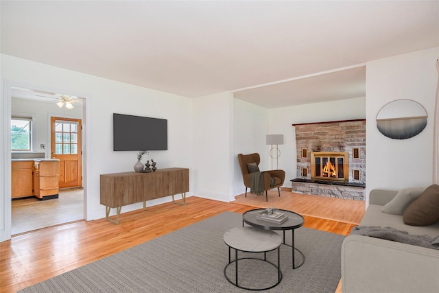 33 Grandview Ave, Pawling, NY 12564 - living area featuring light wood finished floors, a fireplace, and ceiling fan