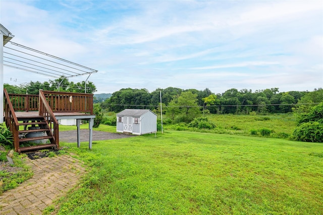 33 Grandview Ave, Pawling, NY 12564 - view of grassy yard featuring a storage shed and a wooden deck
