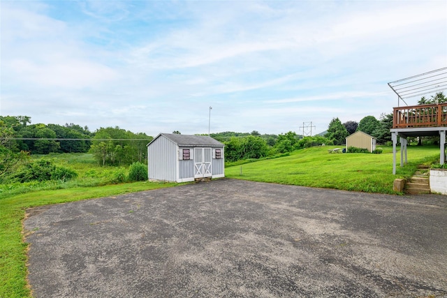 33 Grandview Ave, Pawling, NY 12564 - view of patio / terrace featuring a storage unit and a deck