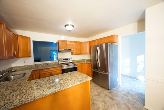 78 Stratford Grn, Farmingdale, NY 11735 - kitchen with stainless steel appliances, under cabinet range hood, light stone countertops, brown cabinets, and a peninsula