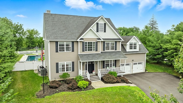 4 Brianna Ln, Yorktown Heights, NY 10598 - traditional-style house featuring a porch, a shingled roof, driveway, and a chimney