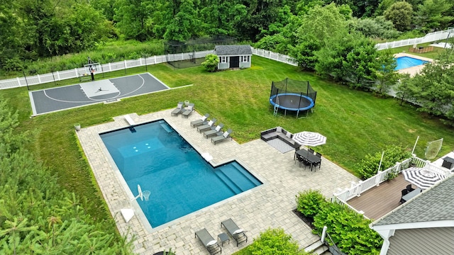 4 Brianna Ln, Yorktown Heights, NY 10598 - view of pool featuring a trampoline, a fenced backyard, and outdoor dining space