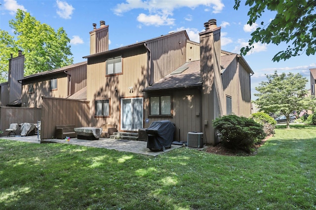24 Wild Birch Farms, Cortlandt Manor, NY 10567 - back of property with a chimney, a patio, a yard, and entry steps